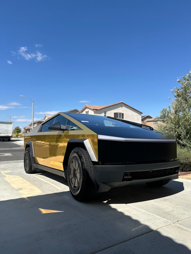 Gold-wrapped Cybertruck gleaming after a wash